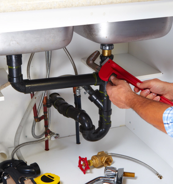 close up of a plumber fixing kitchen sink drainage brandon ms