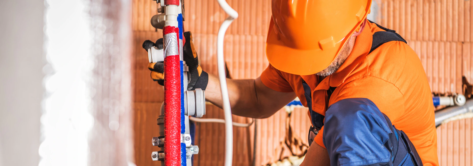 plumber fixing water heater brandon ms